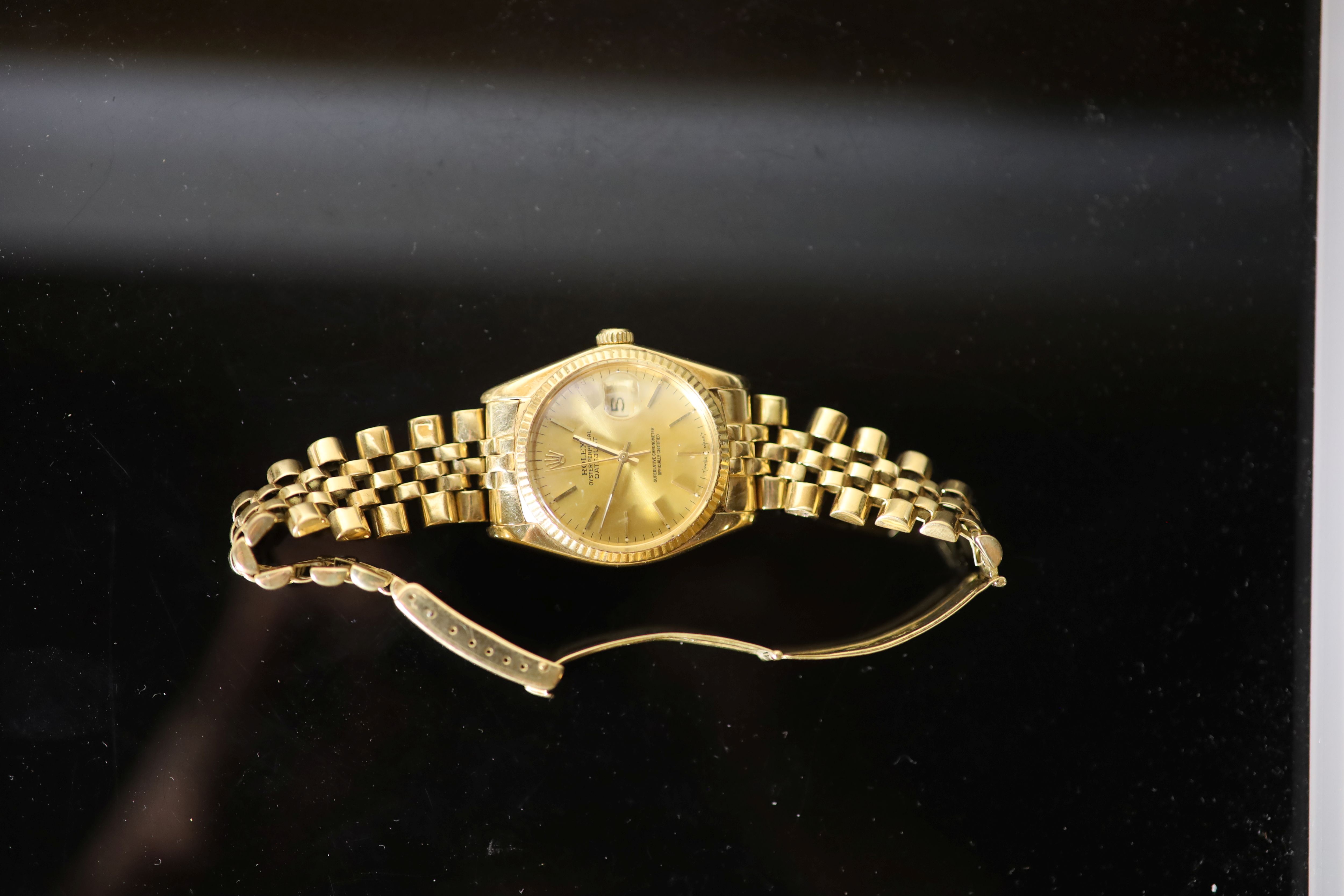 A gentlemans 1990s? 18k gold Rolex Oyster Perpetual Datejust wrist watch, on a 18k gold Rolex bracelet,